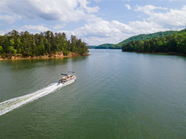 Aerial of a Pontoon boat on a lake