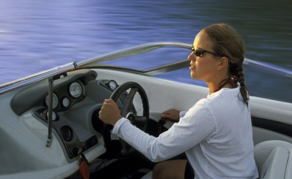 Woman driving a boat