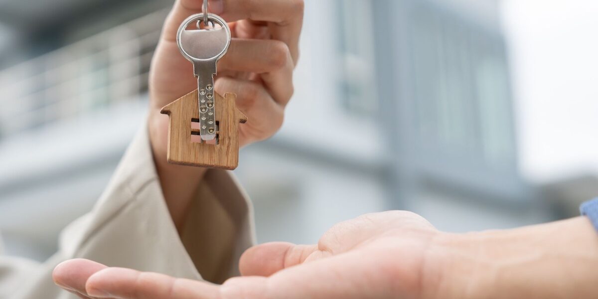 Rental agent providing key