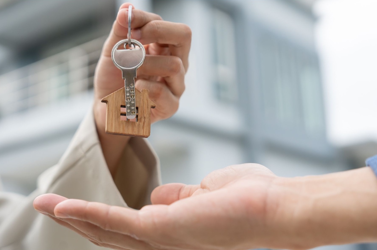 Rental agent providing key