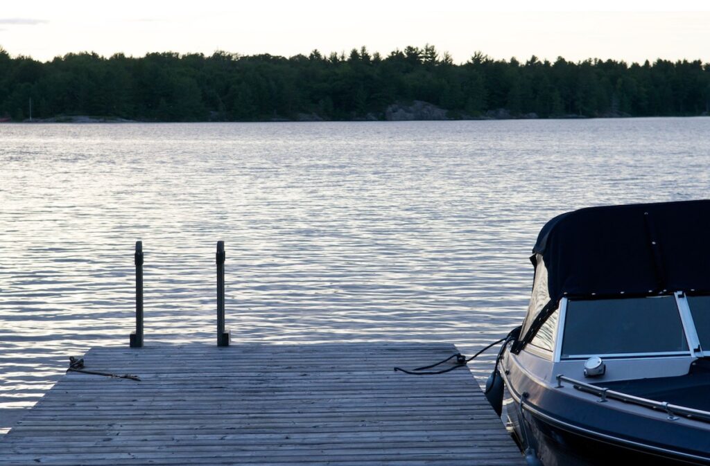 Dock on a lake with a boat tied up