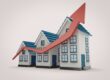 Three houses with a graph arrow going up.