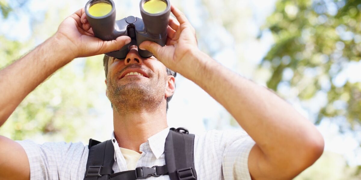 Man with binoculars birding