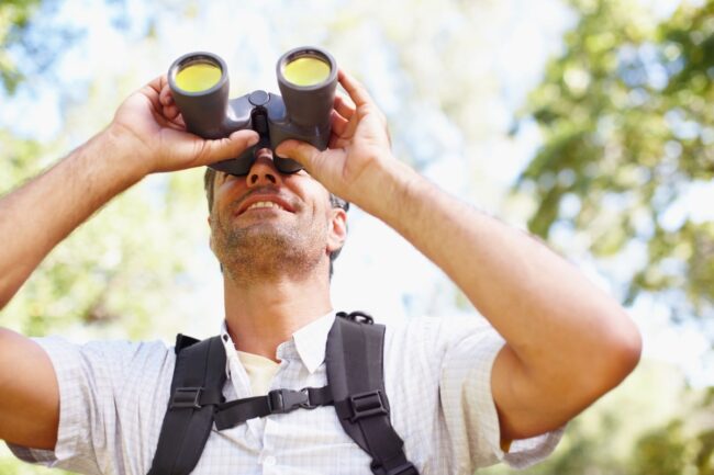 Man with binoculars birding