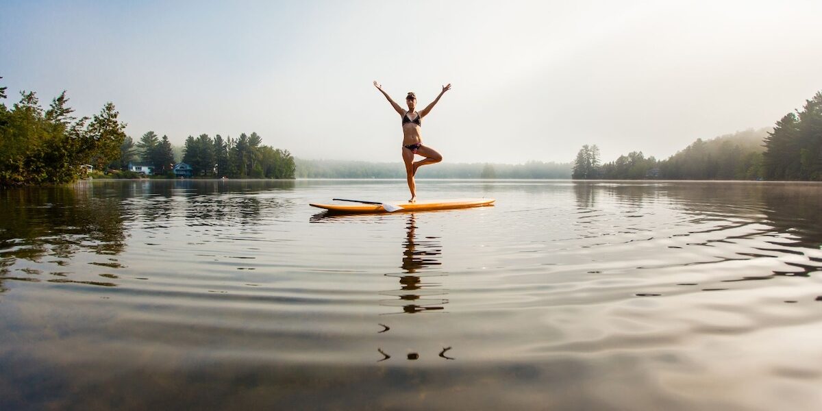 Woman doing yoga on a paddleboard