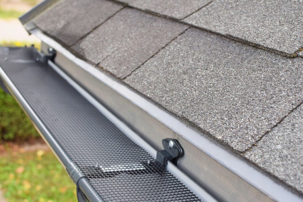 Gutters with mesh covers