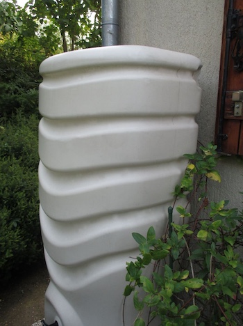 Decorative white rain barrel