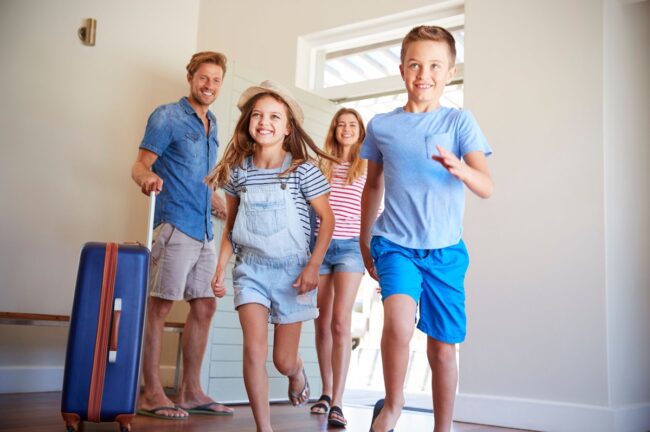 Family entering a rental home