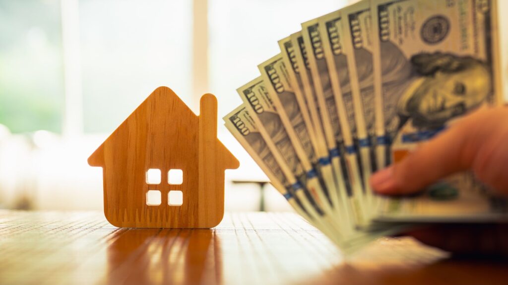 Money with home in background
